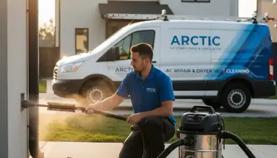 Technician performing professional dryer vent cleaning in Oklahoma City, OK home